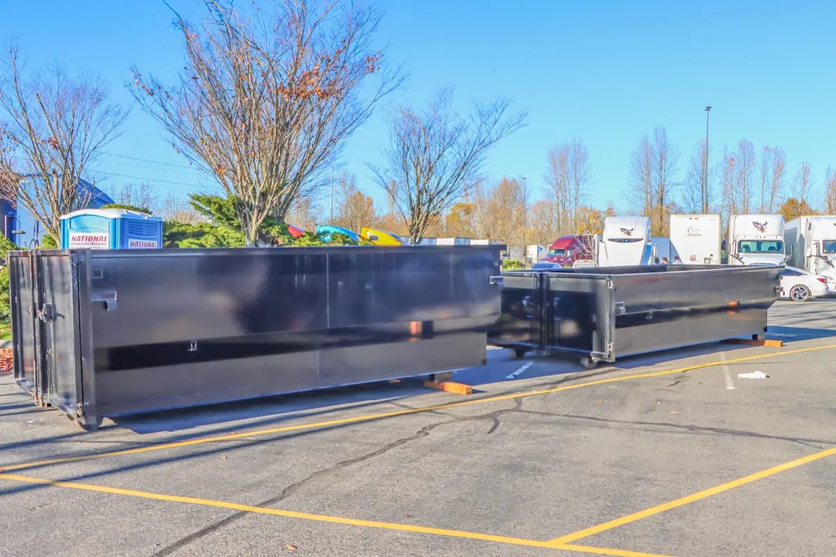 Professional dumpster rental service with roll-off container on residential driveway in Wauwatosa